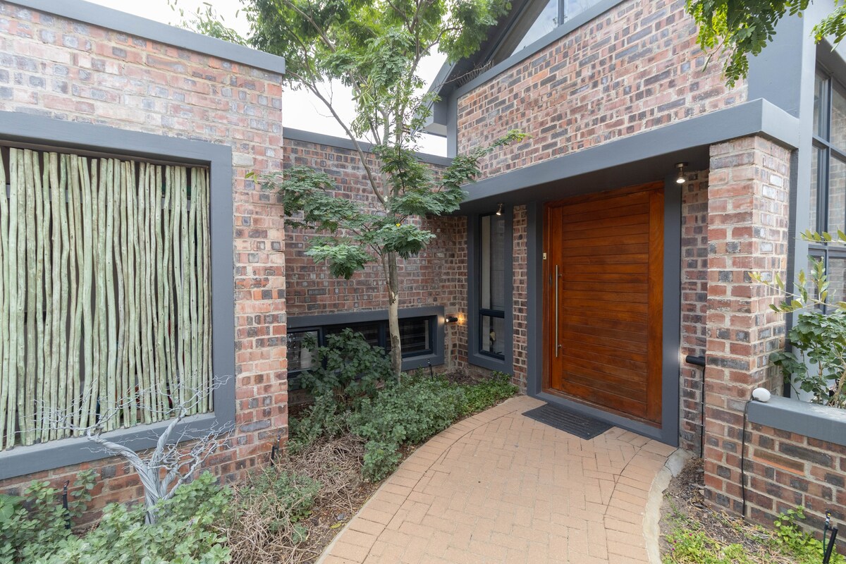 Riebeek Vista entrance with brick walls and wooden door