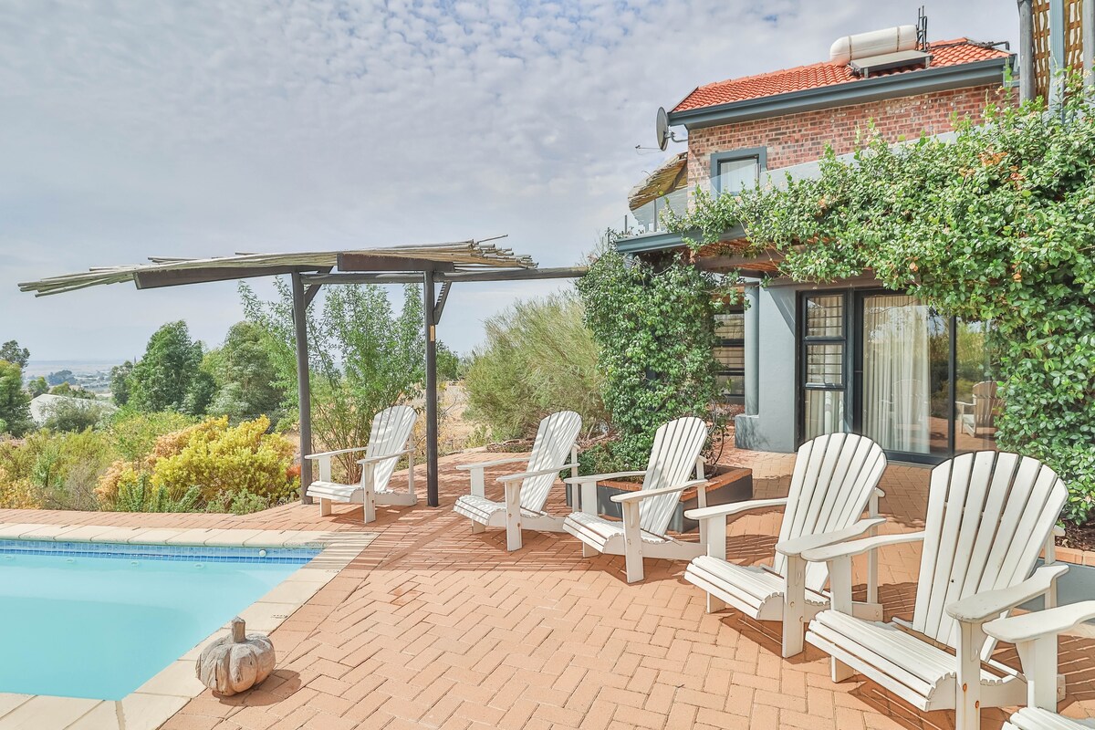 Riebeek Vista pool terrace with outdoor chairs