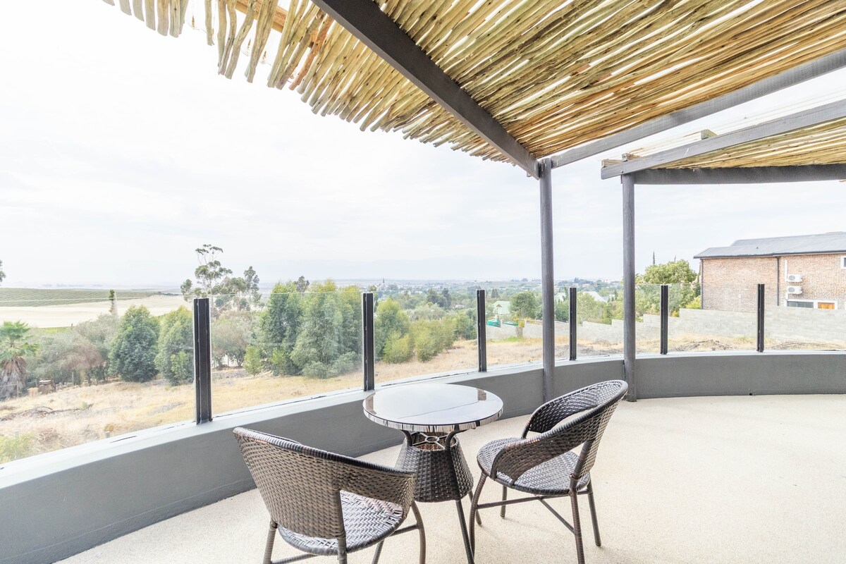Riebeek Vista covered balcony with table and chairs